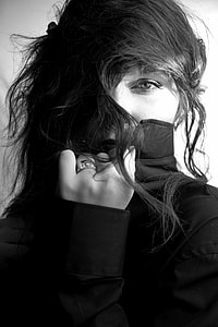 greyscale photography of woman wearing turtleneck sweater thumbnail