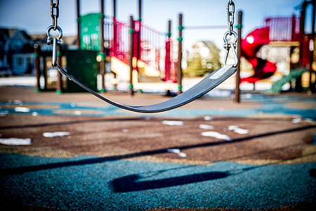 black outdoor swing taken on playground during daytime thumbnail