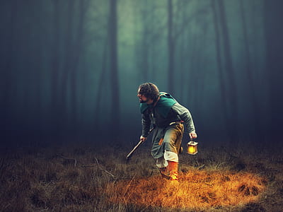 depth photography of man holding lantern thumbnail