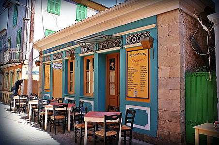 tables with chairs outside store at daytime thumbnail