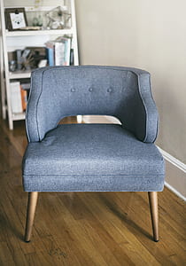 tufted gray padded chair inside the room thumbnail