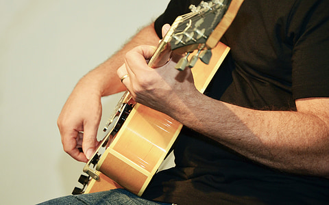man playing acoustic guitar thumbnail