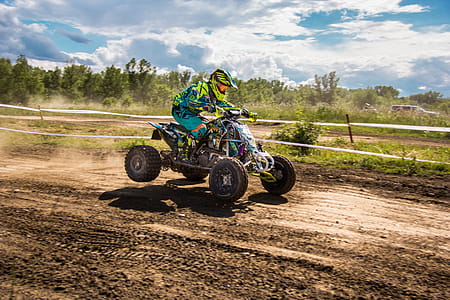 Person Riding Atv Under Sunny Sky thumbnail
