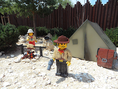 Lego character standing near tent at daytime thumbnail
