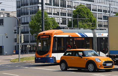 orange Mini Cooper on road during daytime thumbnail