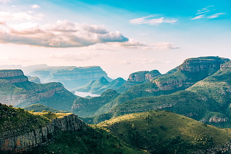 hill of green mountain with clouds photography thumbnail