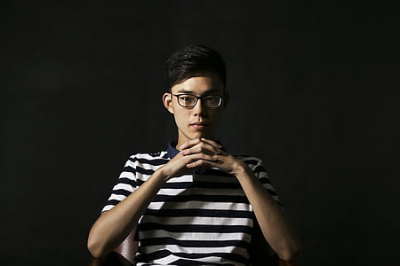 man wearing white and blue striped polo shirt thumbnail