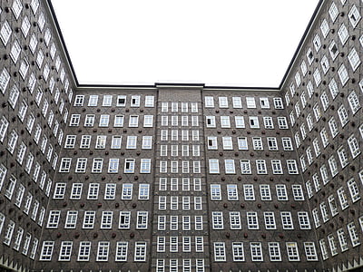 gray concrete building with white windows thumbnail