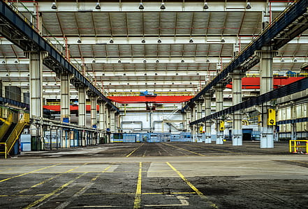 grey concrete floor inside building during daytime thumbnail