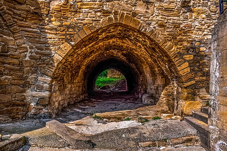 brown concrete tunnel during daytime thumbnail