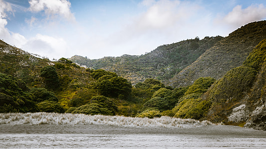 mountain behind body of water thumbnail
