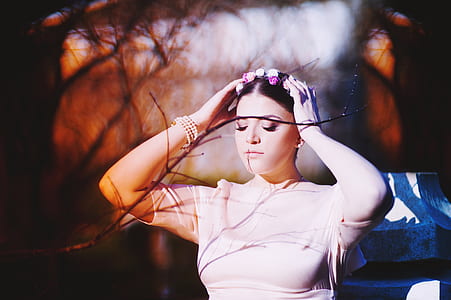 woman holding her headband thumbnail