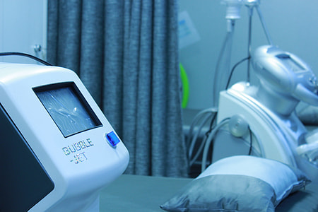 white bubble jet medical machine beside bed thumbnail