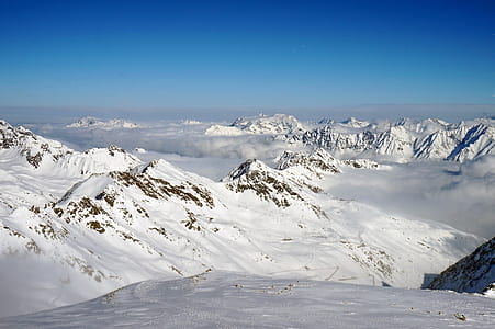 high angle photo of mountain covered with snow thumbnail
