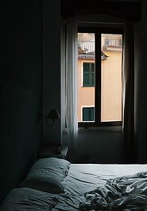 clear glass window panel beside white curtain thumbnail