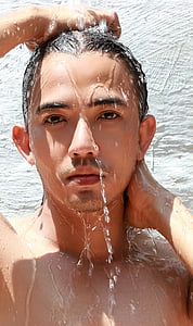 man showering near wall thumbnail