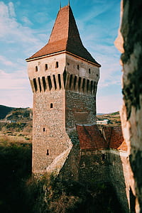 brown concrete castle near cliff thumbnail