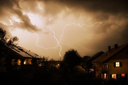 houses under dark clouds thumbnail