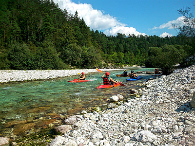 people riding canoes on river thumbnail