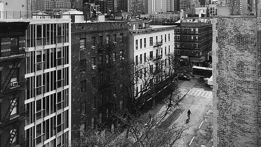 grayscale photography of high rise buildings thumbnail