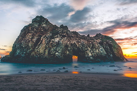 landscape photo of rocky mountain beside shoreline thumbnail