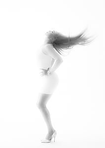 woman wearing white mini dress looking upward thumbnail