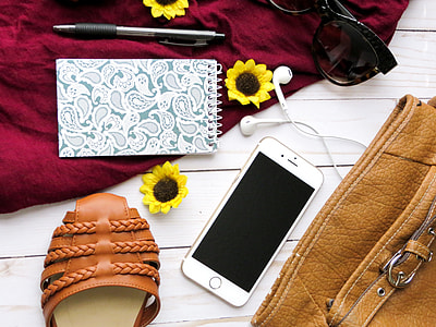 silver iPhone 6 beside brown leather bag thumbnail