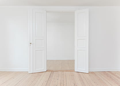 opened white wooden 3-panel door thumbnail