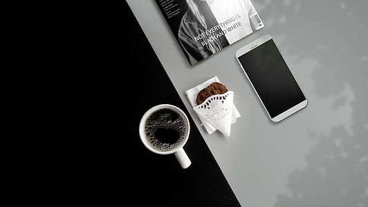 silver smartphone, cup of coffee, and chocolate chip thumbnail