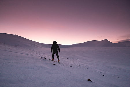 person climbing on on the of the snowy mountain thumbnail