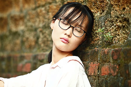 Woman Leaning on Brick Wall thumbnail