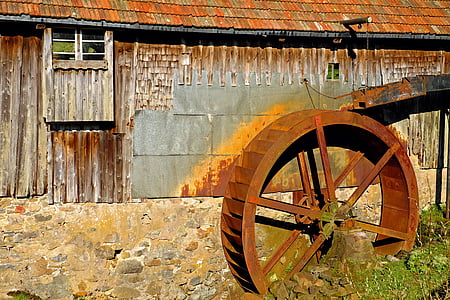 round brown metal wheel during daytime thumbnail