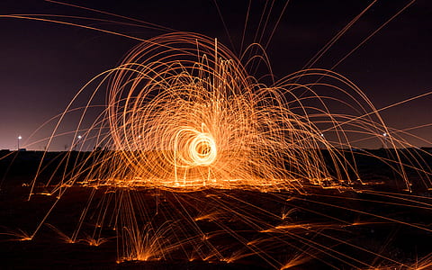 person doing fire dance during nighttime thumbnail
