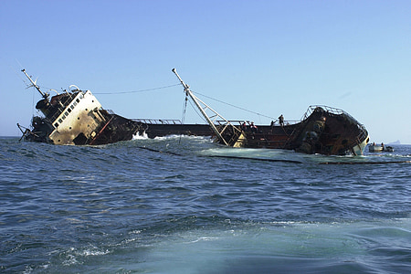 sinking ship under blue sky at daytime thumbnail