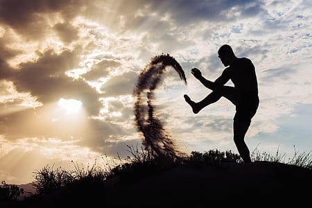 time lapse photography of man kicking the sand thumbnail
