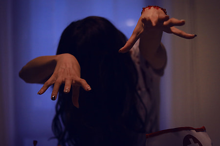woman with black hair doing Sadako pose thumbnail