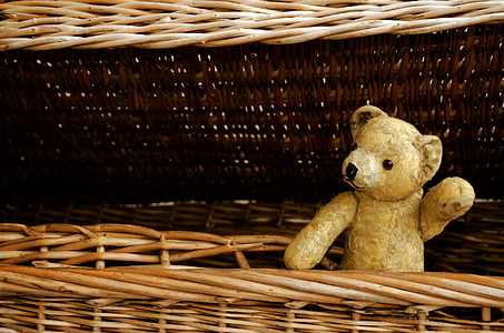 beige bear plush toy on brown wicker basket thumbnail
