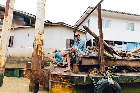 two men on brown trailer thumbnail