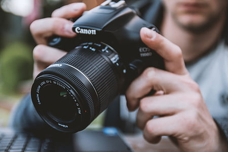 black Canon DSLR camera thumbnail