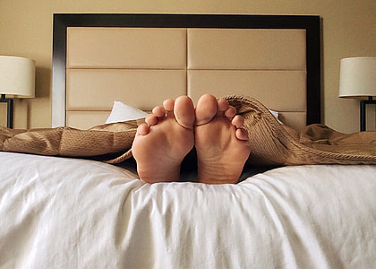 person on white bed thumbnail