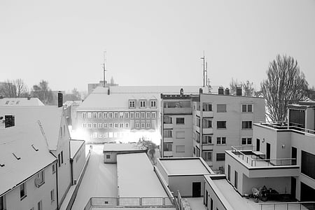 white concrete buildings and houses under white sky thumbnail