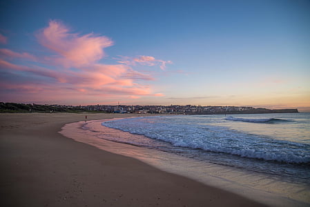 person stands on seashore at daytime thumbnail