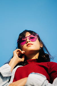 woman in pink sunglasses holding her chin thumbnail