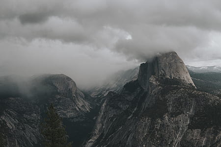 aerial view photography of mountain under cloudy sky thumbnail