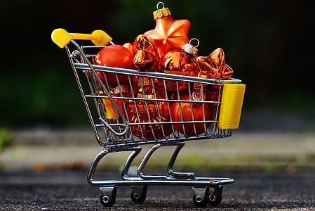 red Christmas baubles in gray metal shopping cart thumbnail