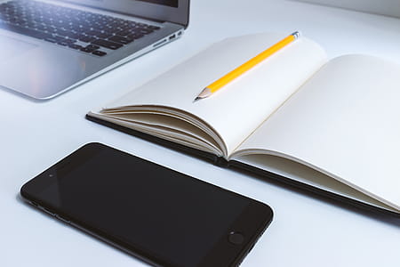 Work table in the office with laptop and smartphone thumbnail