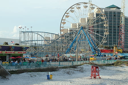 blue and white ferris wheel at daytime thumbnail