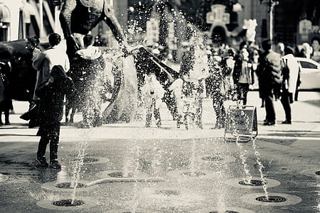 Black and White Photo of Fountain and People thumbnail