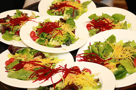 vegetable salads and white plates thumbnail