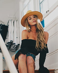 woman in off-shoulder top sitting on stair thumbnail